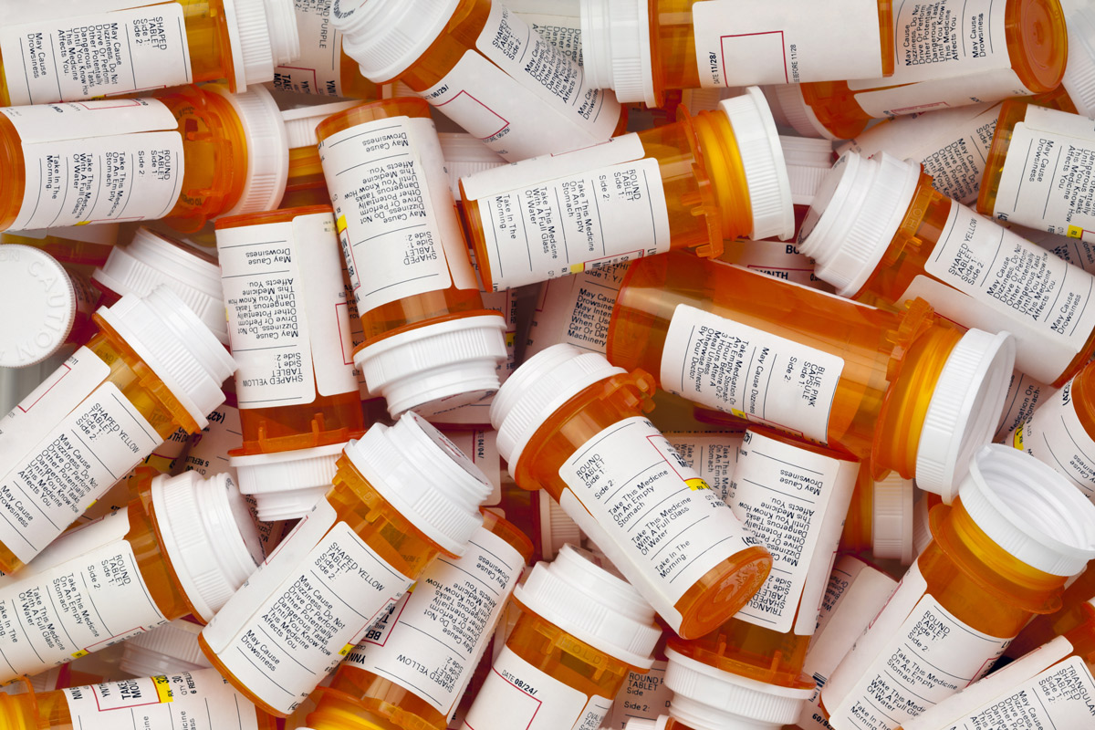 A pile of prescription medication bottles