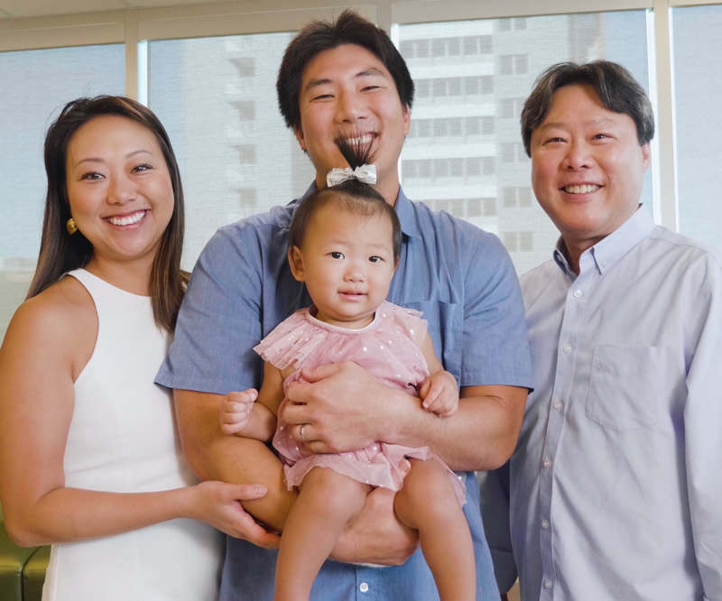 Robert Wada holds daughter Kaila and stands between wife Karen and dad Randy on the third floor of Kapiolani Medical Center's Diamond Head Tower