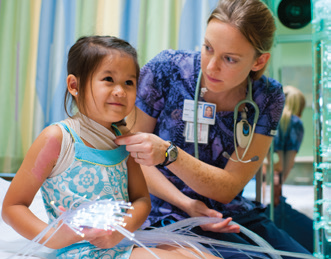 Image of pediatric doctor with a young patient