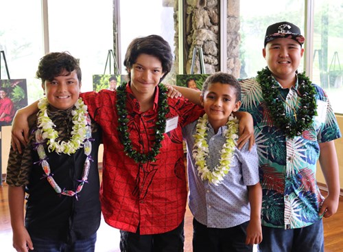 Mahoe Dancel (second from left) stands for a reunion picture with 'Wilcox boys' and fellow Wall of Hope patients (from left) Jayven Alvarez-Hopkins, Bjorn Astrom and Aidan Gadingan. The four boys bonded during their respective inpatient stays at Kapiolani in the Wilcox Unit.