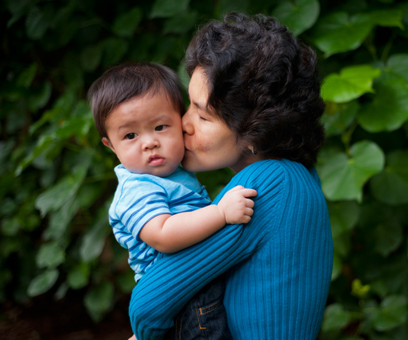 Marol Kawada holds and kisses her youngest son, Michael