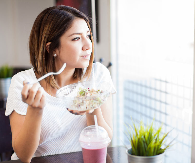Woman eating a healthy smoothie