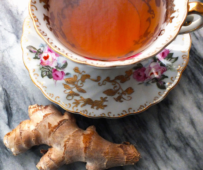 ginger root near a cup of tea