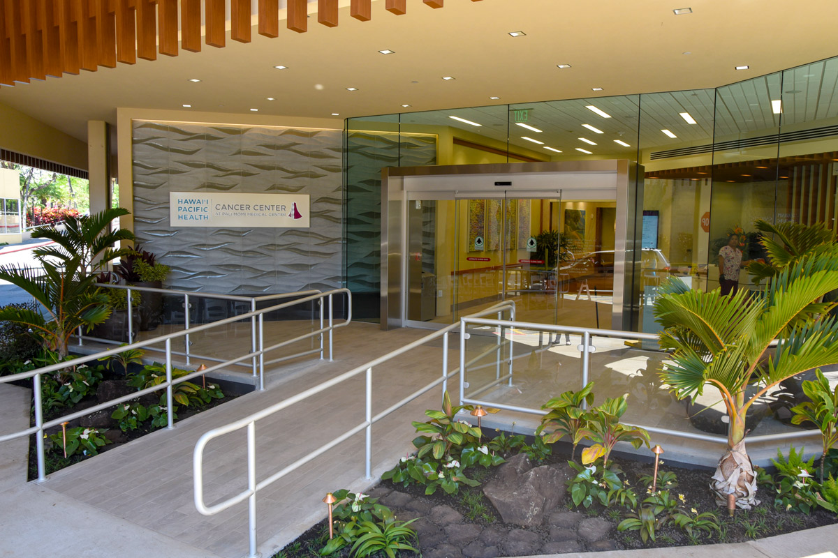 The entry to the Hawaii Pacific Health Cancer Center at Pali Momi Medical Center was designed with patients in mind, from its beautifully landscaped walkway to to large glass doors to let in natural light wheelchair ramp for easy accessibility.