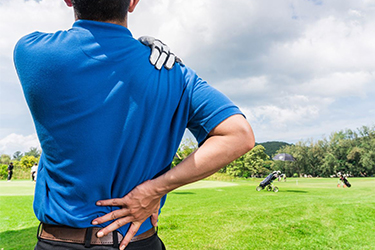 Golfer clutching sore back