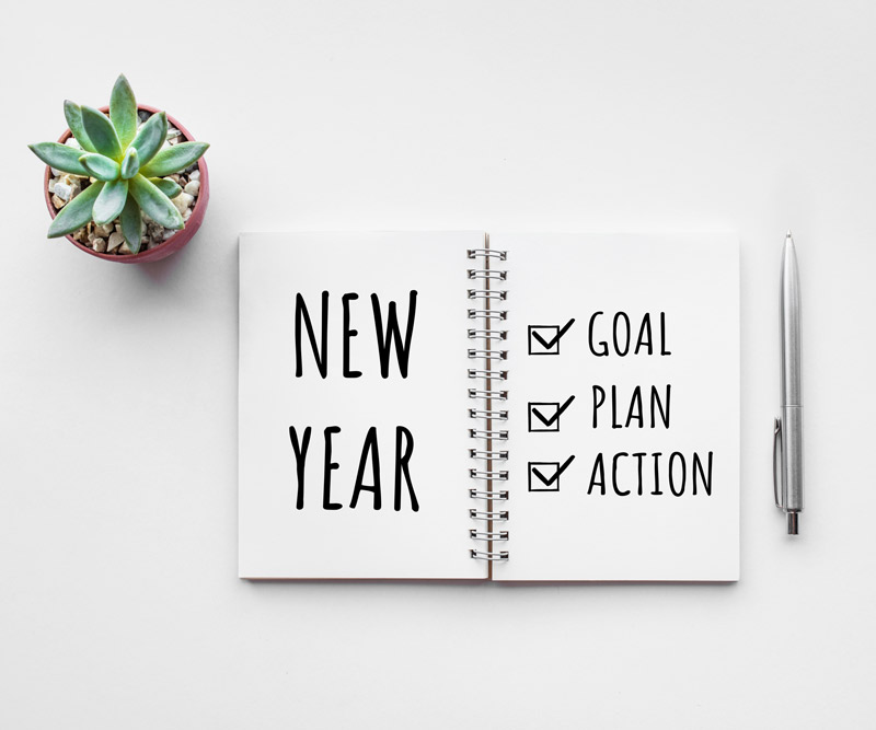Planner with a checklist of goals, plan and action for the New Year