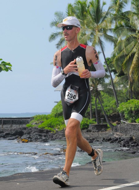 An avid athlete, Dr. Baker (seen here completing the running portion of an IronMan triathlon) has learned the importance of proper hydration through trial and error.