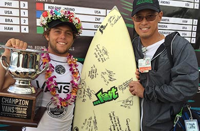 Dr. Spencer Chang and 2017 Vans World Cup Champion Conner Coffin holding a surfboard and a trophy