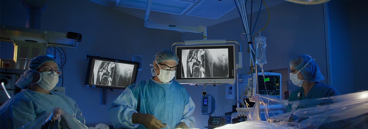 Bone and Joint Team Performing Surgical Operation in Modern Operating Room