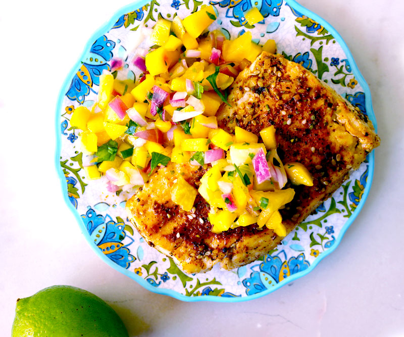 A colorful plate of Cajun-Spiced Mahimahi with Mango Pineapple Salsa
