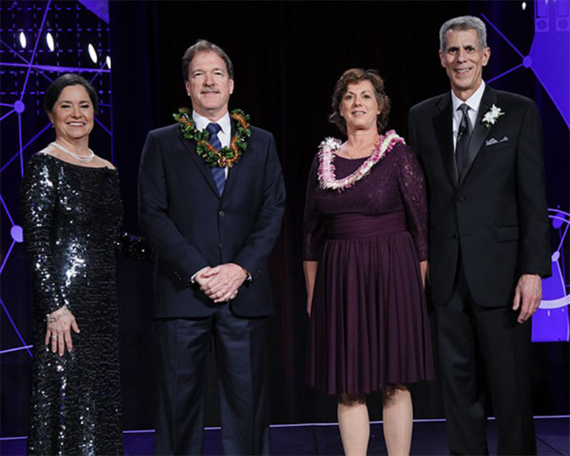 Photo of Hawaii Pacific Health Executive Vice President and Chief Information Officer Steve Robertson (second from left) and Senior Vice President and Chief Quality Officer Melinda Ashton, MD (second from right)