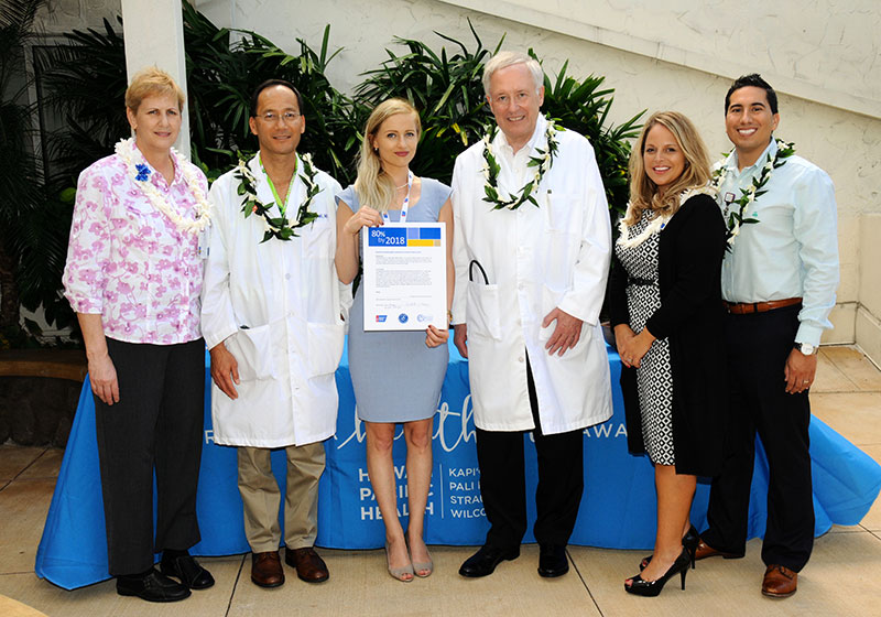 Dr. Ian Okazaki, Straub oncologist (second from left), and Dr. Donald Saelinger, Straub gastroenterologist (fourth from left) signed the National Colorectal Cancer Roundtable's "80% by 2018" commitment pledge on behalf of Straub Medical Center.