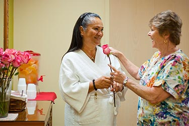 Patient at Pali Momi Medical Center given a rose by her nurse