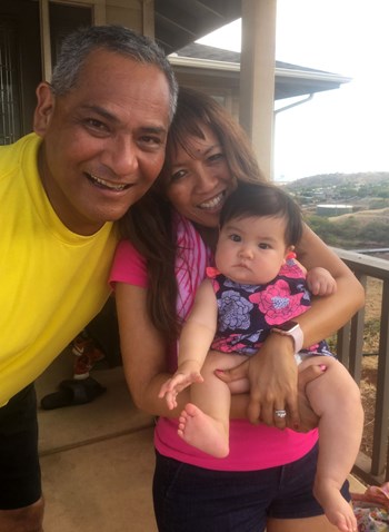 Cheri with husband Abe, their granddaughter and Cheri's infamous 'Tina' wig.