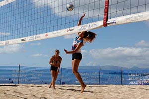 two women playing beach volleyball at the annual Hawaii Beach Volleyball State Championships