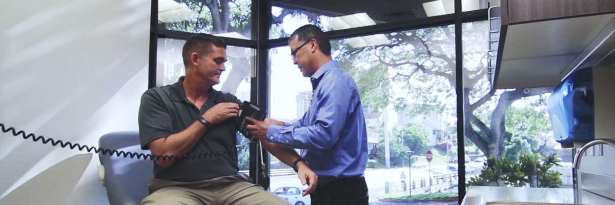 Doctor measuring patient's blood pressure