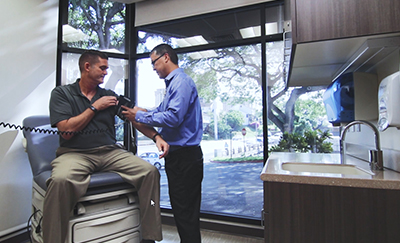 Doctor measuring patient's blood pressure