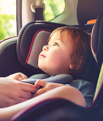 little girl in car seat