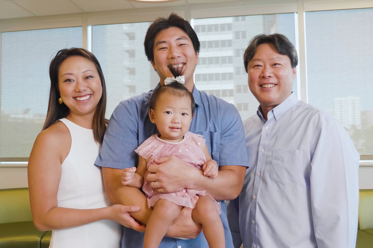 Robert Wada holds daughter Kaila and stands between wife Karen and dad Randy on the third floor of Kapiolani Medical Center's Diamond Head Tower