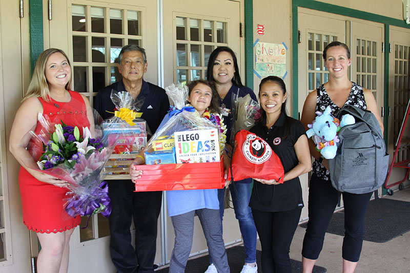 Patient Lily with her family and friends