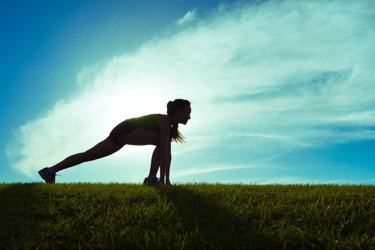 woman in start position for a run