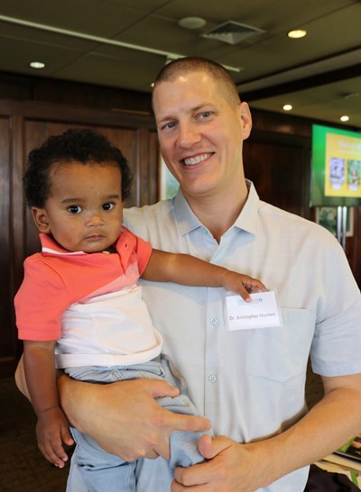 Silas Senones-Waller gets a lift from Dr. Kristopher Hooten, the Kapiolani neurosurgeon who performed the complex surgery to correct the infant's Chiari malformation.