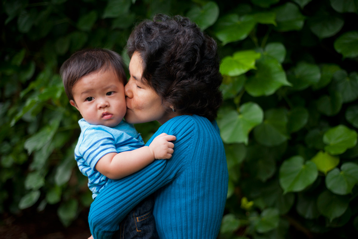 Marol Kawada holds and kisses her youngest son, Michael