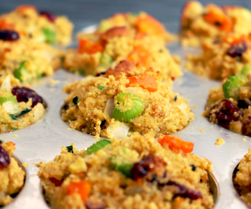 a muffin baking pan filled with cornbread stuffing mix