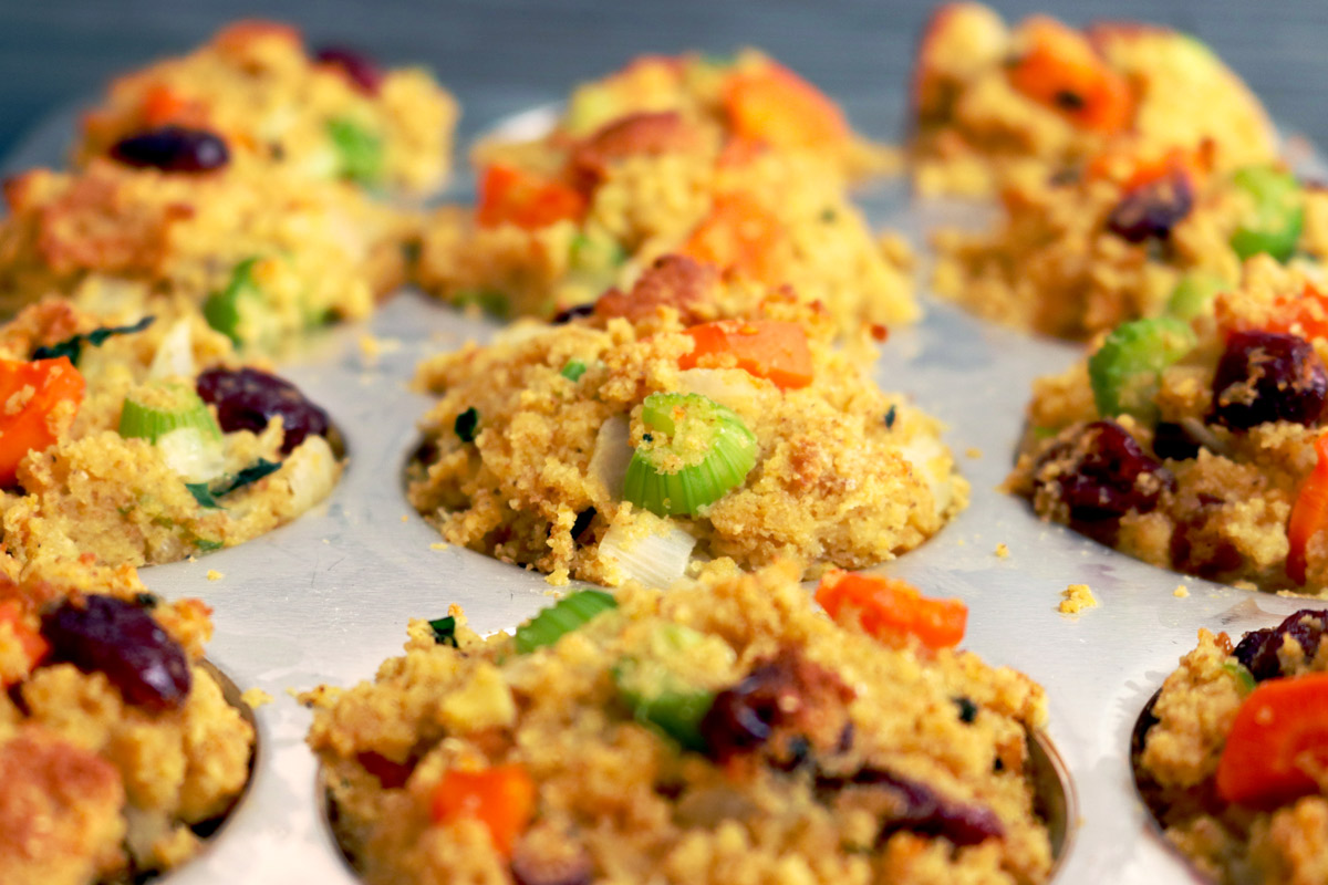 a muffin baking pan filled with cornbread stuffing mix