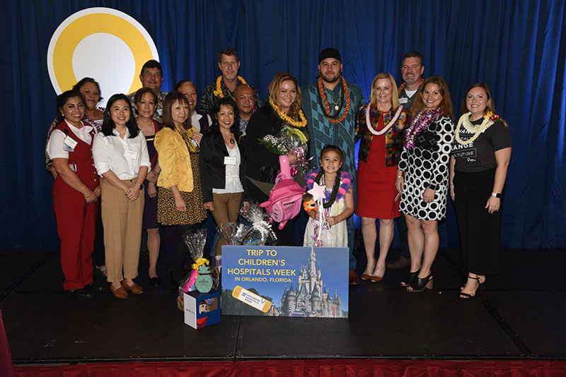 Large group of people with 2020 Hawaii CMN Champion Haumea Friel
