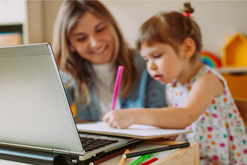Mother and daughter learning from home