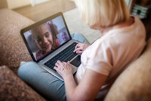 Women video chatting with family