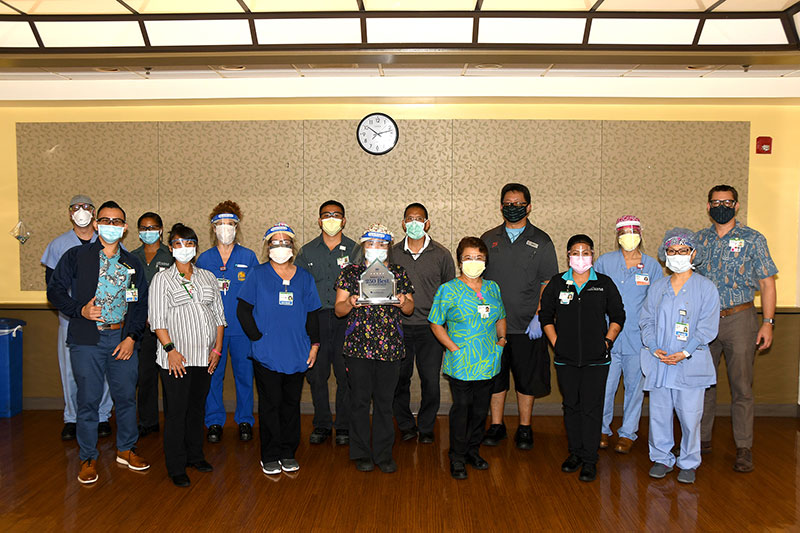 Group of Straub healthcare workers holding award trophy