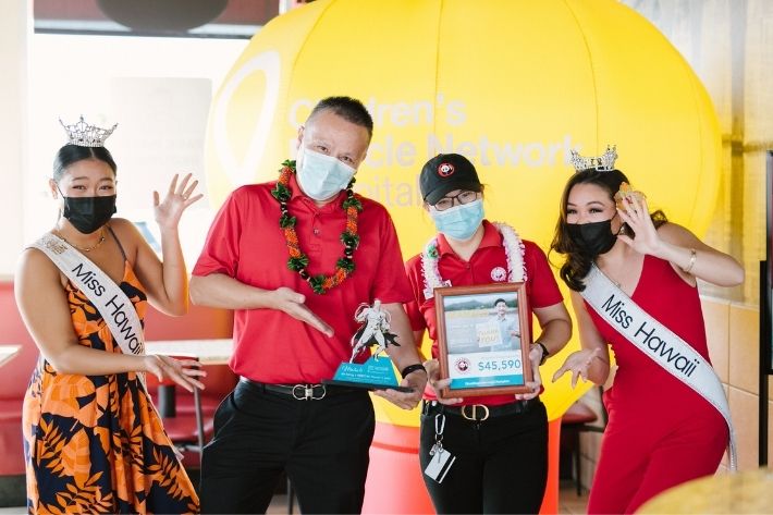 Group celebrating Panda Express donation