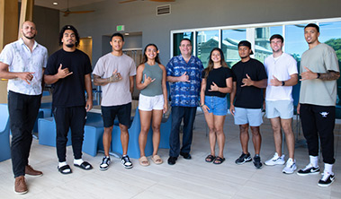 Student athletes from the University of Hawaii at Manoa with Hawaii Pacific Health CEO Ray Vara