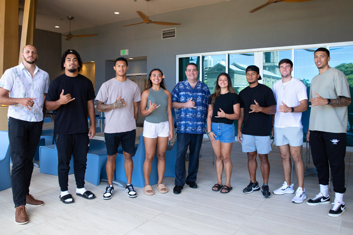 Student athletes from the University of Hawaii at Manoa with Hawaii Pacific Health CEO Ray Vara