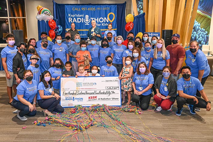 Volunteers, radio personalities, supporters and families at the end of the Kapiolani Radiothon for Kids