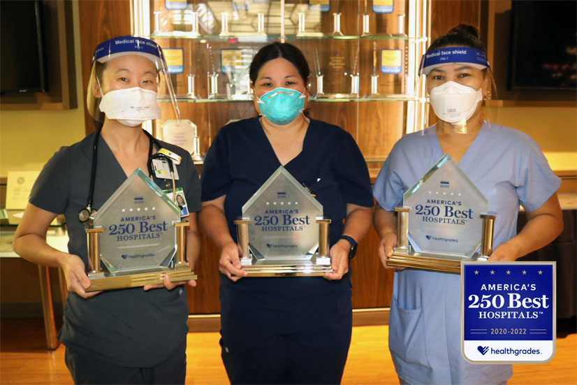 Straub Medical Center employees holding Healthgrades awards