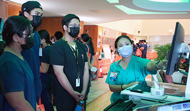 High school students at a demonstration at the Wilcox Health Careers Fair