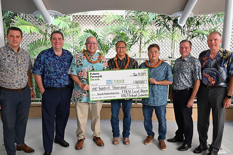 Straub redevelopment donation group with giant check
