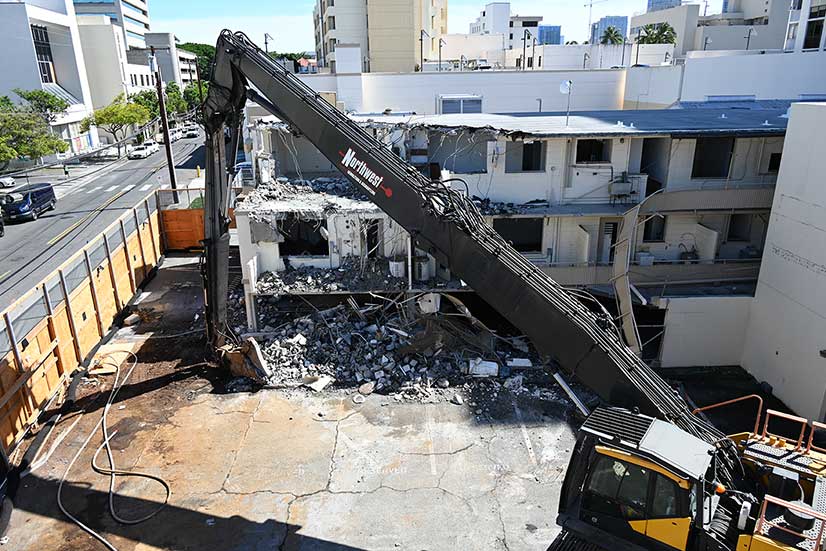building demolition with excavator