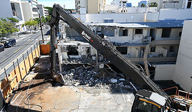 building demolition with excavator