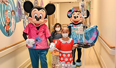 young patients with Mickey and Minnie Mouse characters at Kapiolani