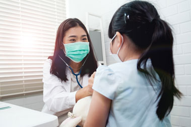 physician examining pediatric patient