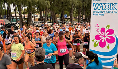 large group of women runners at the starting line