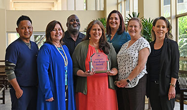Group shot of Wilcox medical Center staff with Healthgrades award.