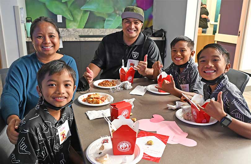 Family enjoying lunch together at Kapiolani medical Center dining room