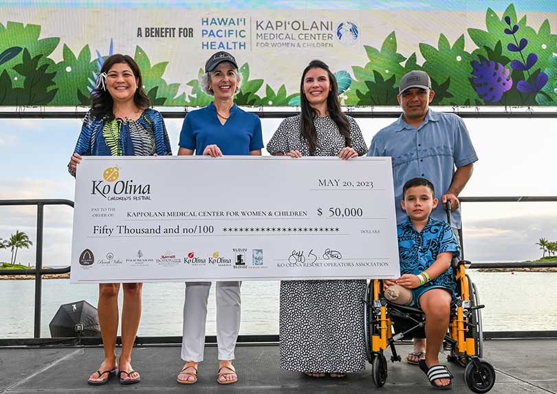 Small group with giant check for $50,000.