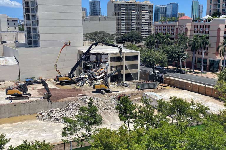 Demolition equipment tears down the former Physical Therapy and Occupational Therapy Health Services building located on 800 South King Street.