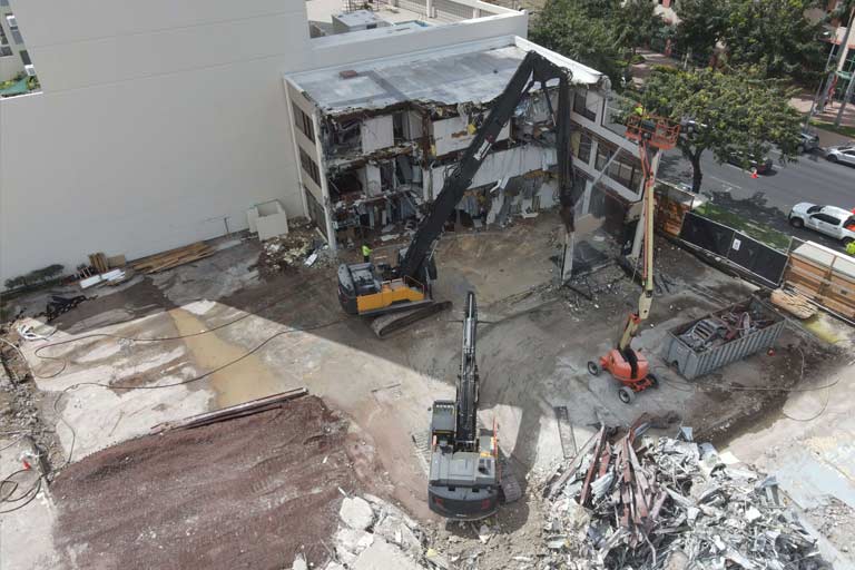 An aeriel view of crews as they demolish the former building location of the Physical Therapy and Occupational Therapy Health Services.